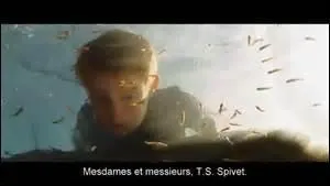 D'après T.S., à quoi ressemble le père de Layton ?