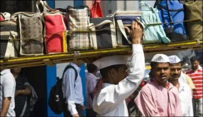 En Inde, la personne qui prend les déjeuners des ouvriers pour leur rendre à leur lieux de travail s'appelle :