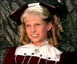 N- Quelle insupportable petite fille Harriet adopte-t-elle dans la série "La petite maison dans la prairie" ?