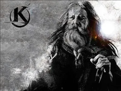 Comment est habillé Merlin ?