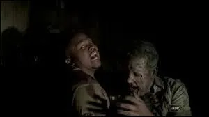 Pour qui T-Dog se sacrifie-t-il ?