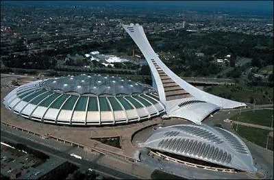 Quel est l'évènement sportif de l'année 1976 à Montréal, qui confirma sa place de grande métropole, après celui de 67 ? et dans quel quartier pauvre eut lieu l'évènement ?
