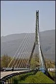 Quel est ce pont haubané sur le Rhône entre l'Ain et la Haute-Savoie construit
en 1987 ?