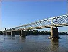 Ce pont routier en treillis, de 297 mètres de long sur la Loire, dans le département du Maine-et-Loire, a été construit en 1889 à :
