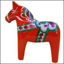 Dans quel pays pépé René a-t-il déniché cette figurine en bois traditionnelle ?