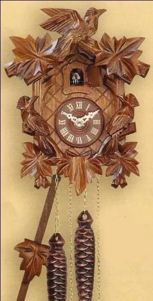 Quel cri d'oiseau sert de sonnerie à la pendule qui figure sur la photo ?