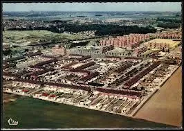 Ville de la banlieue de Valenciennes, elle est située sur l'Escaut. Ancienne capitale du charbon et de l'acier, il suffit de changer une lettre au mot "demain" pour trouver mon nom.