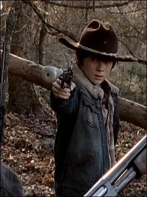 Après l'attaque du Gouverneur, Carl abat froidement quelqu'un sous les yeux médusés d'Hershel. De qui s'agit-il  ?