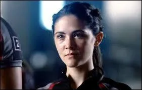 À quel district le garçon qui a essayé de tuer Katniss appartenait-il lors du bain de sang à la Corne d'Abondance ?