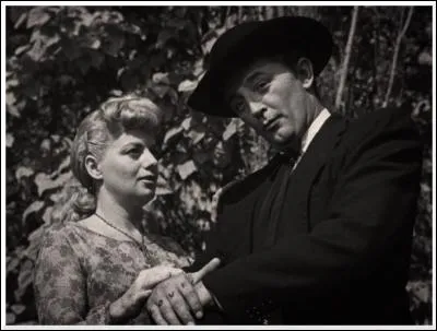 Dans quel film, un pasteur machiavélique épouse-t-il la veuve d'un assassin ?