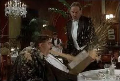 Ci-contre, on retrouve un maître d'hôtel (joué par John Cleese) ayant fort à faire avec Mr Creosote (incarné par Terry Jones). Ce dernier étant un client obèse, se goinfrant et vomissant outrageusement tout au long de son repas. De quelle oeuvre cinématographique des Monty Python est tirée cette séquence ?