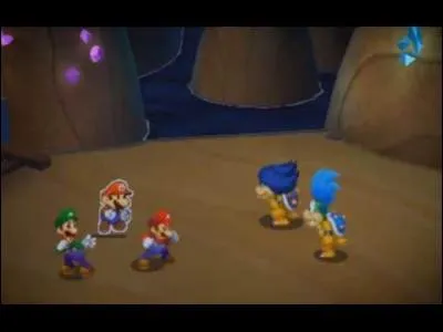 Quel est l'effet de la première carte de combat qu'utilise Ludwig lors de son premier combat duo avec Larry face aux frères Mario ?