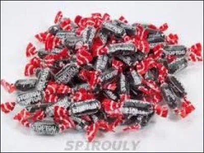 Ce bonbon oblong, noir et délicieusement parfumé a un nom un peu banal voire prétentieux, car il se nomme Stoptou. A quel parfum est-il  ?
