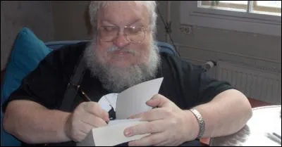 Combien de livres Martin compte-t-il encore écrire pour clôturer la saga ?