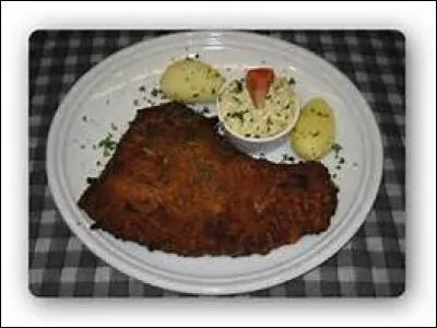 Dans les bouchons, les amateurs d'abats se régalent en mangeant un...