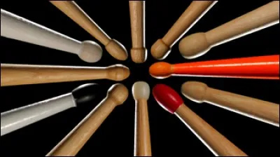 Comment nomme-t-on l'extrémité rebondie des baguettes du tambour ?