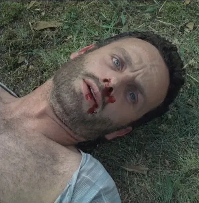 Que lui répond Rick après s'être pris un coup de pelle ?