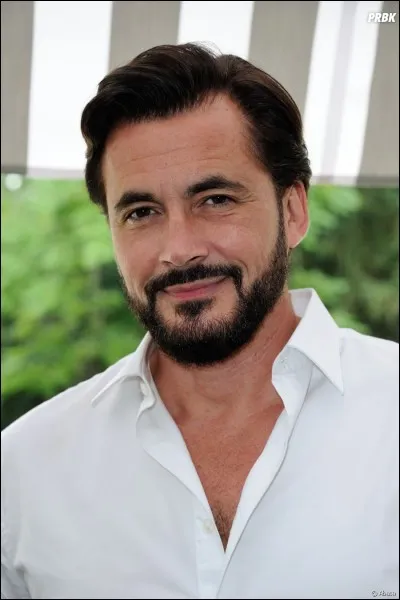 Quelle est la taille d'Olivier Minne ?